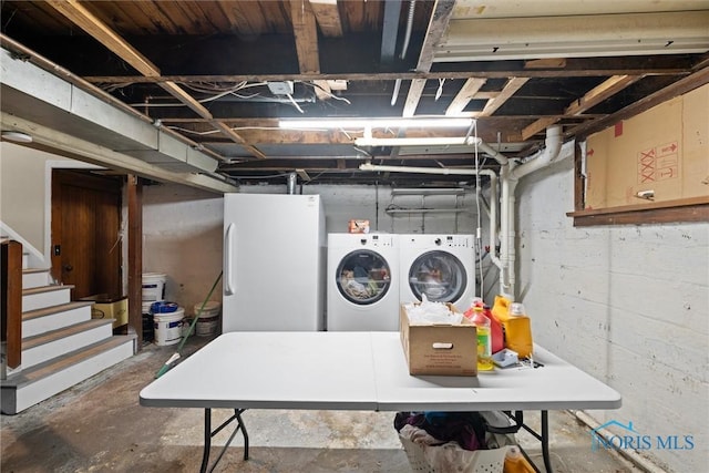 1930 Berkshire Pl, Toledo, OH 43613 - unfinished below grade area with washing machine and dryer, freestanding refrigerator, and stairway