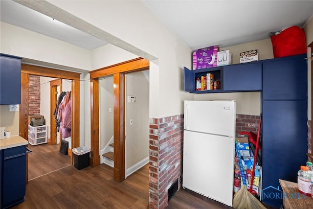 1930 Berkshire Pl, Toledo, OH 43613 - kitchen with freestanding refrigerator, blue cabinetry, dark wood-style flooring, light countertops, and open shelves