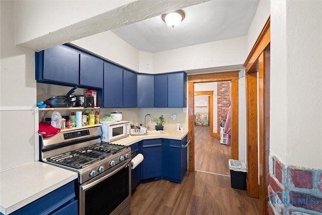 1930 Berkshire Pl, Toledo, OH 43613 - kitchen with blue cabinets, stainless steel range with gas cooktop, dark wood-style flooring, white microwave, and light countertops