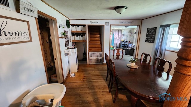 403 W Chestnut St, Wauseon, OH 43567 - dining area featuring wood finished floors and ornamental molding