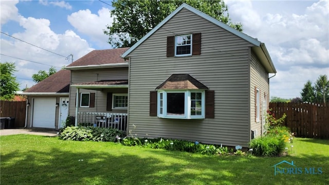 403 W Chestnut St, Wauseon, OH 43567 - view of front of property featuring an attached garage and driveway