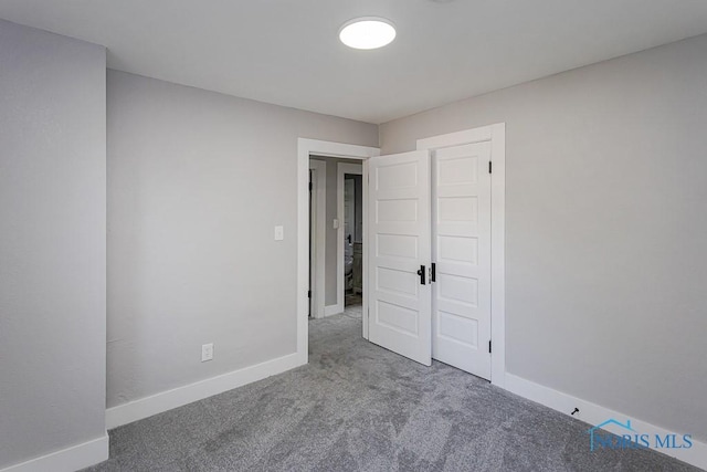 2242 Vaness Dr, Toledo, OH 43615 - unfurnished bedroom with carpet floors and baseboards