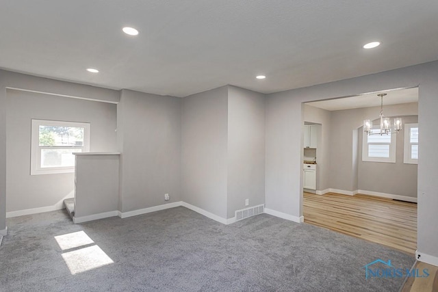 2242 Vaness Dr, Toledo, OH 43615 - unfurnished room with a chandelier, recessed lighting, and carpet