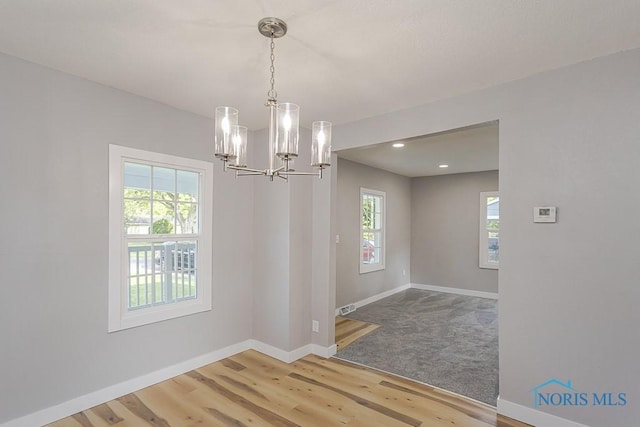 2242 Vaness Dr, Toledo, OH 43615 - unfurnished dining area featuring wood finished floors, a chandelier, and recessed lighting