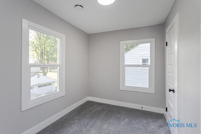 2242 Vaness Dr, Toledo, OH 43615 - empty room with baseboards and dark colored carpet