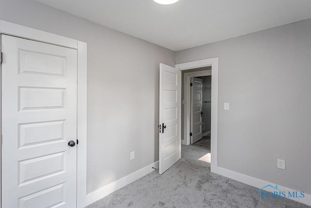 2242 Vaness Dr, Toledo, OH 43615 - unfurnished bedroom featuring carpet floors and baseboards