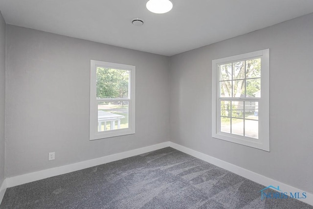 2242 Vaness Dr, Toledo, OH 43615 - unfurnished room with dark carpet and baseboards