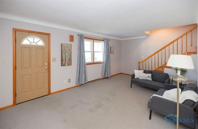 404 E Garfield Ave, Swanton, OH 43558 - carpeted entryway featuring stairway and baseboards