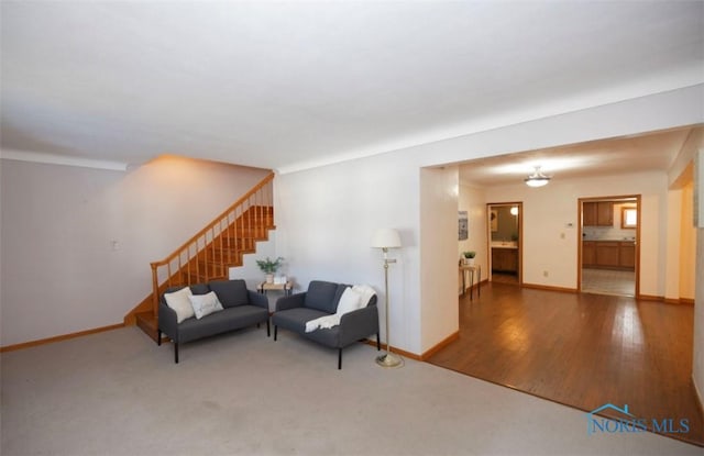 404 E Garfield Ave, Swanton, OH 43558 - living room featuring stairway and baseboards