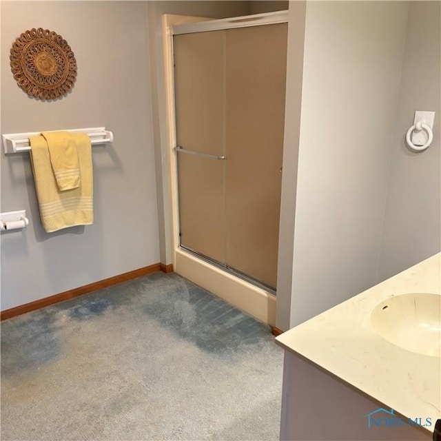 404 E Garfield Ave, Swanton, OH 43558 - bathroom with a stall shower, vanity, and carpet flooring