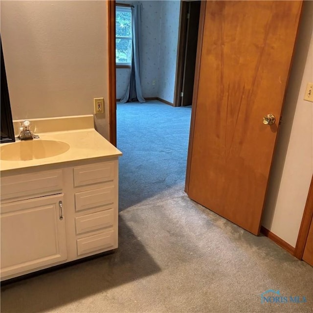 404 E Garfield Ave, Swanton, OH 43558 - bathroom featuring carpet floors and vanity