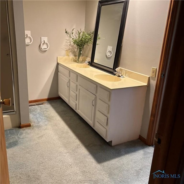 404 E Garfield Ave, Swanton, OH 43558 - full bathroom with carpet floors and double vanity