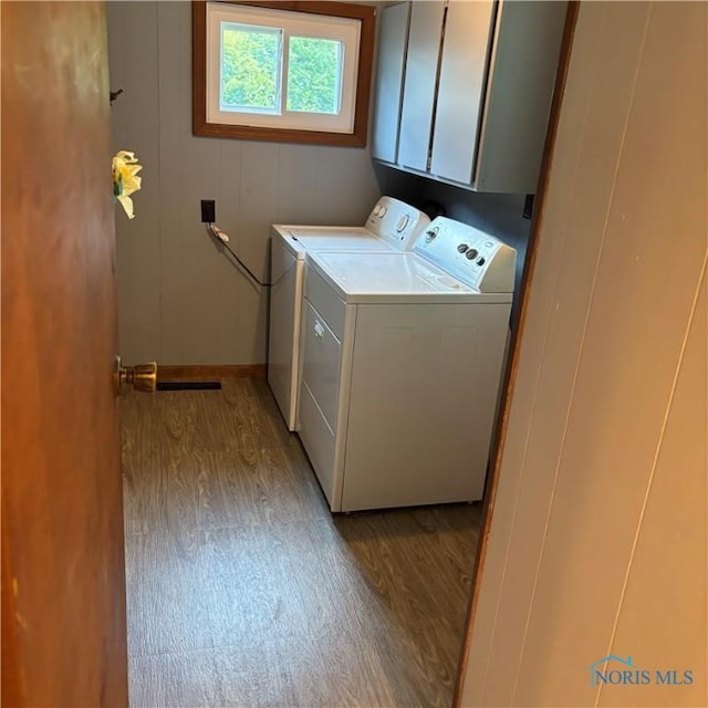 404 E Garfield Ave, Swanton, OH 43558 - laundry room with cabinet space, light wood-style floors, and washing machine and dryer