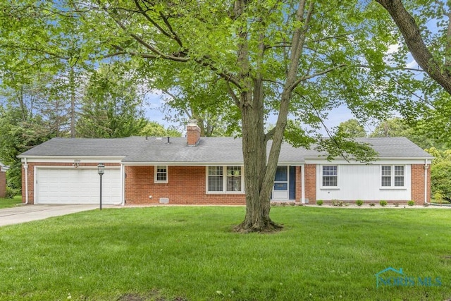 3733 Shamrock Dr, Toledo, OH 43615 - single story home featuring an attached garage, a chimney, brick siding, concrete driveway, and a front lawn