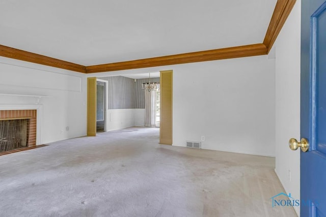 3733 Shamrock Dr, Toledo, OH 43615 - unfurnished living room with carpet flooring, a chandelier, a brick fireplace, and wainscoting