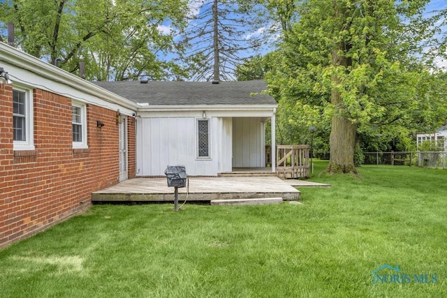 3733 Shamrock Dr, Toledo, OH 43615 - back of house featuring a wooden deck, board and batten siding, brick siding, and roof with shingles