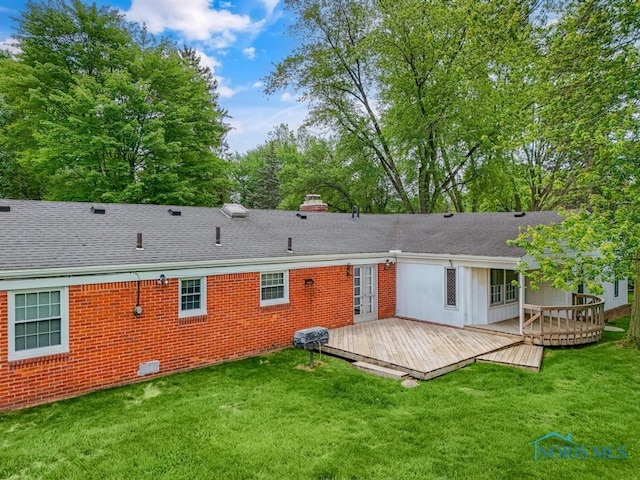 3733 Shamrock Dr, Toledo, OH 43615 - rear view of house with a deck, a yard, and a shingled roof