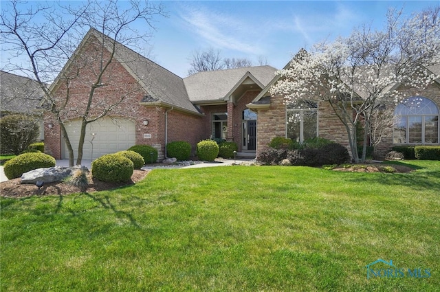 3862 Ravine Hollow Ct, Maumee, OH 43537 - traditional home with a front yard, brick siding, a garage, and a shingled roof