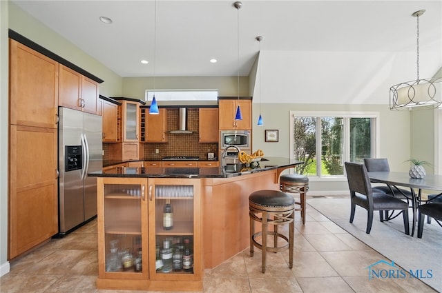 3862 Ravine Hollow Ct, Maumee, OH 43537 - kitchen featuring stainless steel appliances, wall chimney range hood, a kitchen bar, glass insert cabinets, and tasteful backsplash