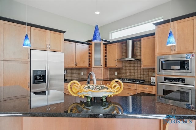 3862 Ravine Hollow Ct, Maumee, OH 43537 - kitchen with appliances with stainless steel finishes, wall chimney range hood, backsplash, dark stone counters, and decorative light fixtures