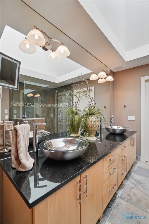 3862 Ravine Hollow Ct, Maumee, OH 43537 - bathroom with double vanity, a shower with door, and marble finish flooring