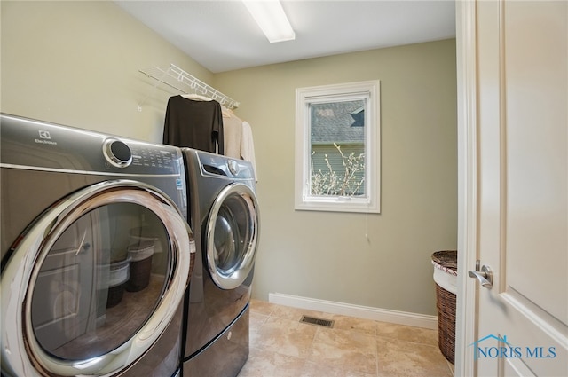 3862 Ravine Hollow Ct, Maumee, OH 43537 - washroom featuring independent washer and dryer and light tile patterned floors