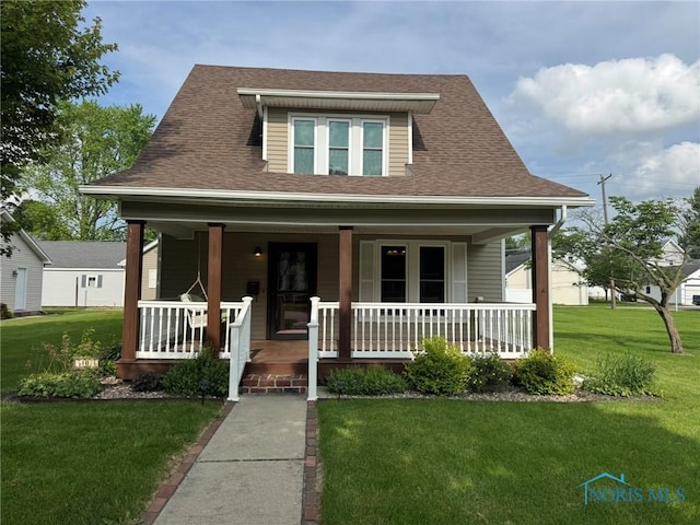 506 Ditto St, Archbold, OH 43502 - bungalow with a porch, a front yard, and a shingled roof