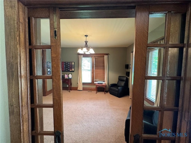 506 Ditto St, Archbold, OH 43502 - carpeted living area featuring a chandelier