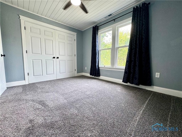 716 Davidson St, Defiance, OH 43512 - unfurnished bedroom with wood ceiling, carpet floors, a ceiling fan, and a closet