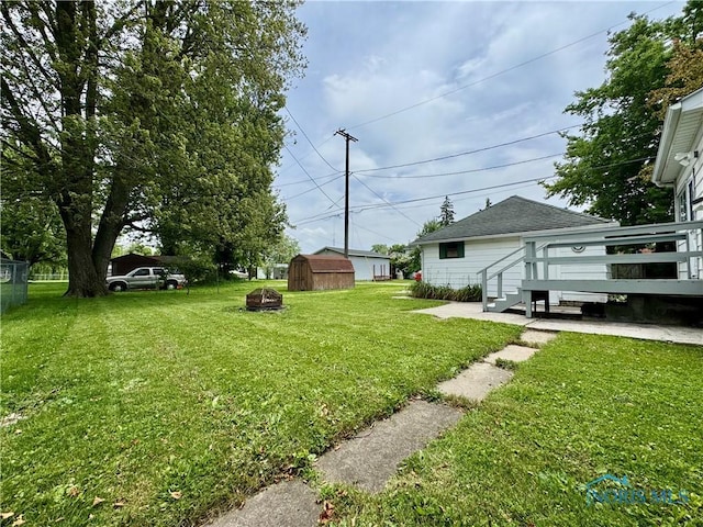 716 Davidson St, Defiance, OH 43512 - view of yard featuring a storage shed and a wooden deck