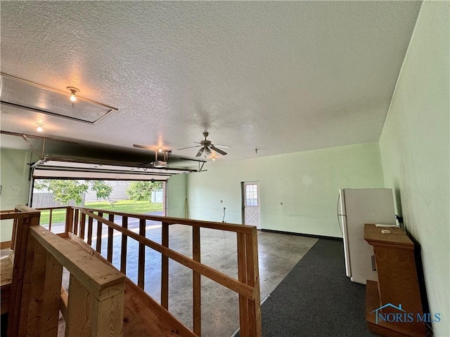 220 Rolland St, Bryan, OH 43506 - corridor featuring a textured ceiling and an upstairs landing