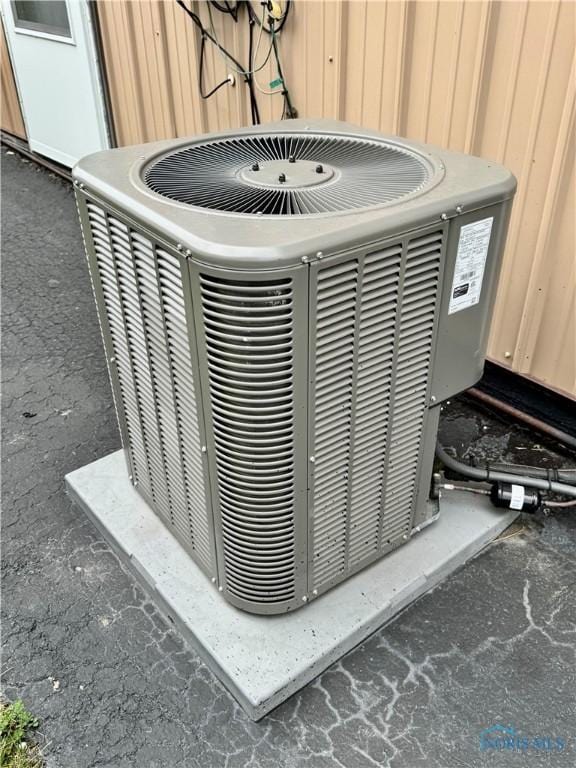 220 Rolland St, Bryan, OH 43506 - exterior view of a central air condition unit