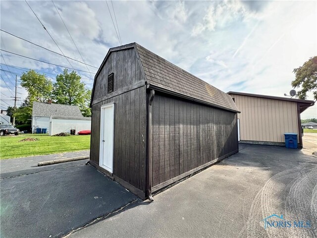 220 Rolland St, Bryan, OH 43506 - garage featuring a storage shed