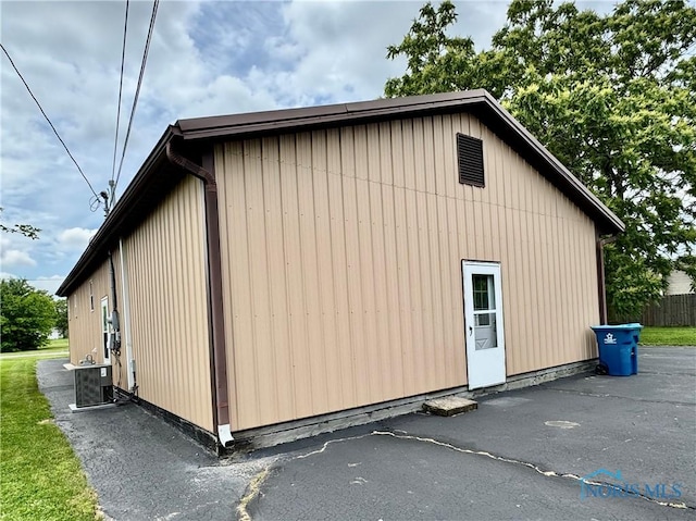220 Rolland St, Bryan, OH 43506 - view of home's exterior featuring a central air condition unit
