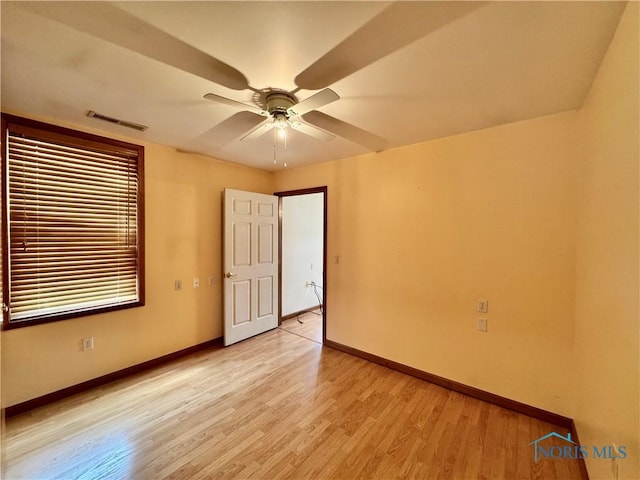 220 Rolland St, Bryan, OH 43506 - empty room with light wood-style floors and ceiling fan