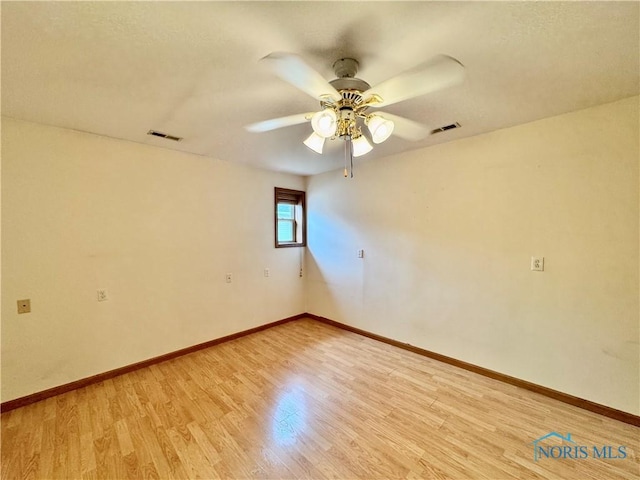 220 Rolland St, Bryan, OH 43506 - unfurnished room with light wood-style flooring and a ceiling fan