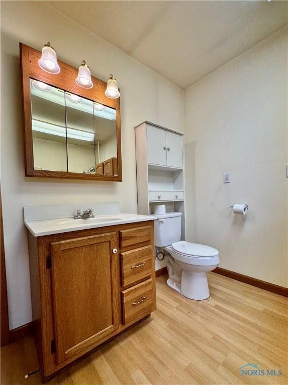 220 Rolland St, Bryan, OH 43506 - bathroom with vanity and wood finished floors