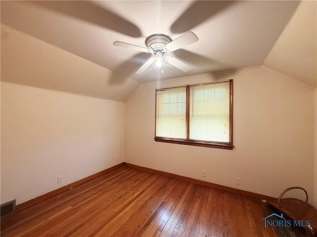 703 College Ave, Fostoria, OH 44830 - bonus room with vaulted ceiling, wood finished floors, and a ceiling fan