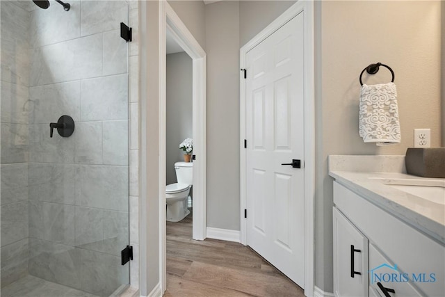 3343 Moonlit Pass, Monclova, OH 43542 - bathroom with a stall shower, wood finished floors, and vanity