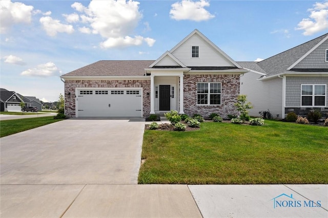 3343 Moonlit Pass, Monclova, OH 43542 - view of front of house with driveway, a garage, a front yard, and brick siding