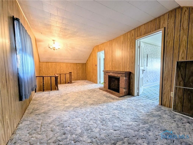 6151 The Bend Rd, Ney, OH 43549 - bonus room featuring carpet floors, lofted ceiling, wooden walls, and a fireplace