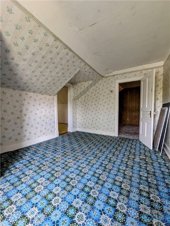 6151 The Bend Rd, Ney, OH 43549 - additional living space featuring wallpapered walls, carpet flooring, and vaulted ceiling