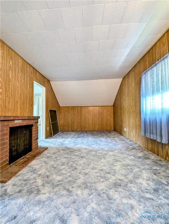 6151 The Bend Rd, Ney, OH 43549 - bonus room with carpet floors, wooden walls, a fireplace, and lofted ceiling