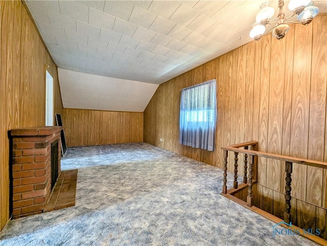 6151 The Bend Rd, Ney, OH 43549 - additional living space with carpet floors, wood walls, a chandelier, and vaulted ceiling