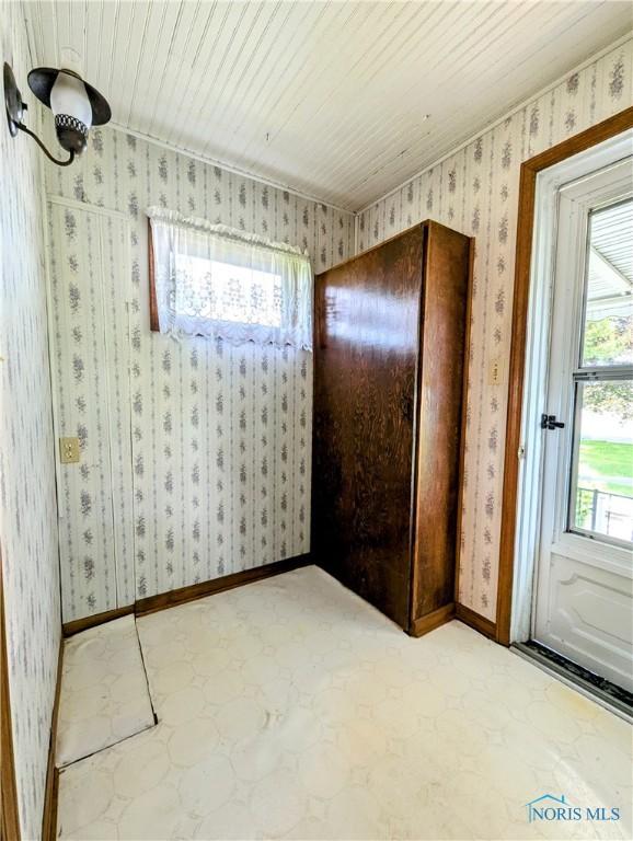 6151 The Bend Rd, Ney, OH 43549 - spare room featuring wallpapered walls