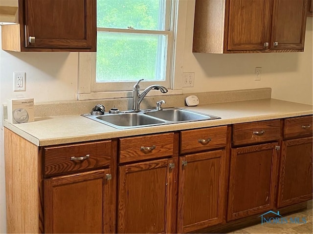 643 N 5th St, Fremont, OH 43420 - kitchen with light countertops and brown cabinets