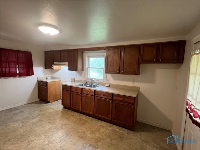 643 N 5th St, Fremont, OH 43420 - kitchen featuring under cabinet range hood and light countertops