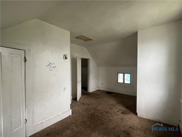 643 N 5th St, Fremont, OH 43420 - additional living space with lofted ceiling, carpet floors, and attic access