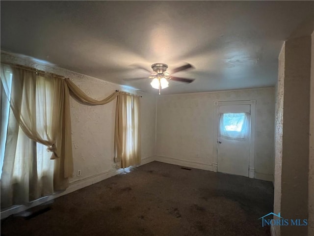 643 N 5th St, Fremont, OH 43420 - unfurnished room with ceiling fan, dark carpet, and a textured wall