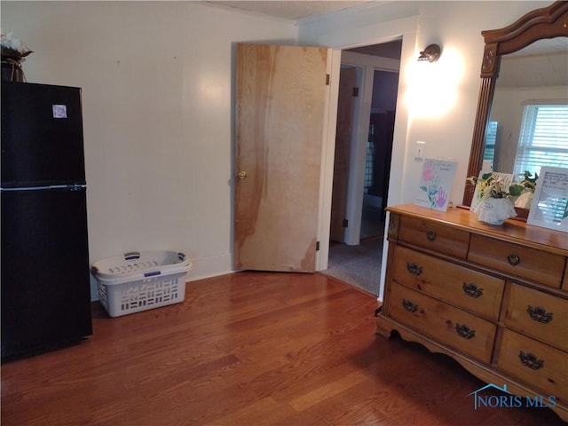 200 Pleasant St, Archbold, OH 43502 - bedroom with freestanding refrigerator and wood finished floors